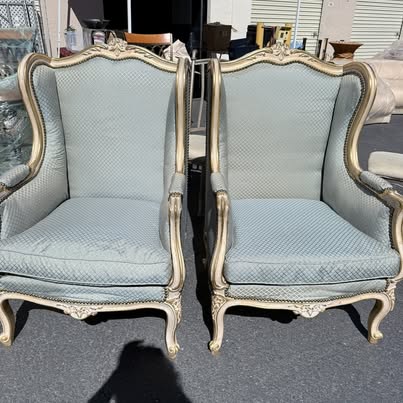 Pair gilt-framed light blue wingback chairs
